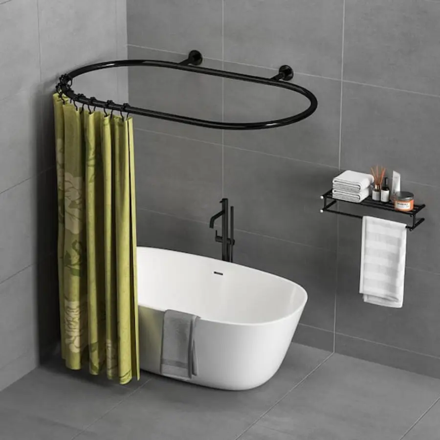 Clawfoot tub with a curved shower curtain rod and patterned green curtain.