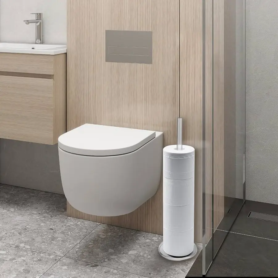 Modern bathroom featuring a wall-mounted toilet and a nearby toilet paper holder.
