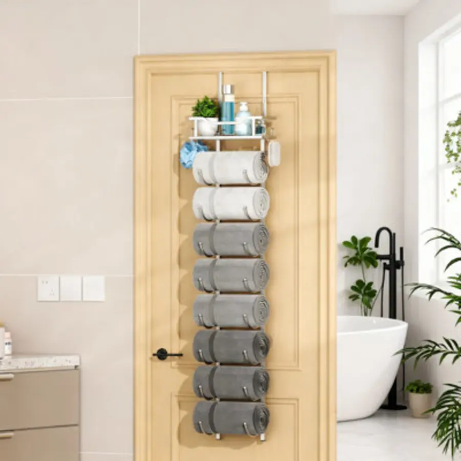 Over-door towel rack displaying neatly rolled towels in varying shades of gray.