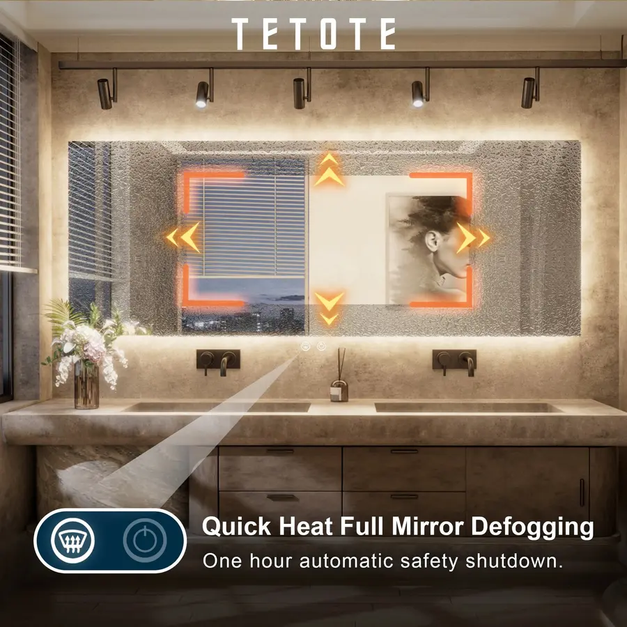 A modern bathroom with a large mirror and defogging feature, showcasing moisture management.