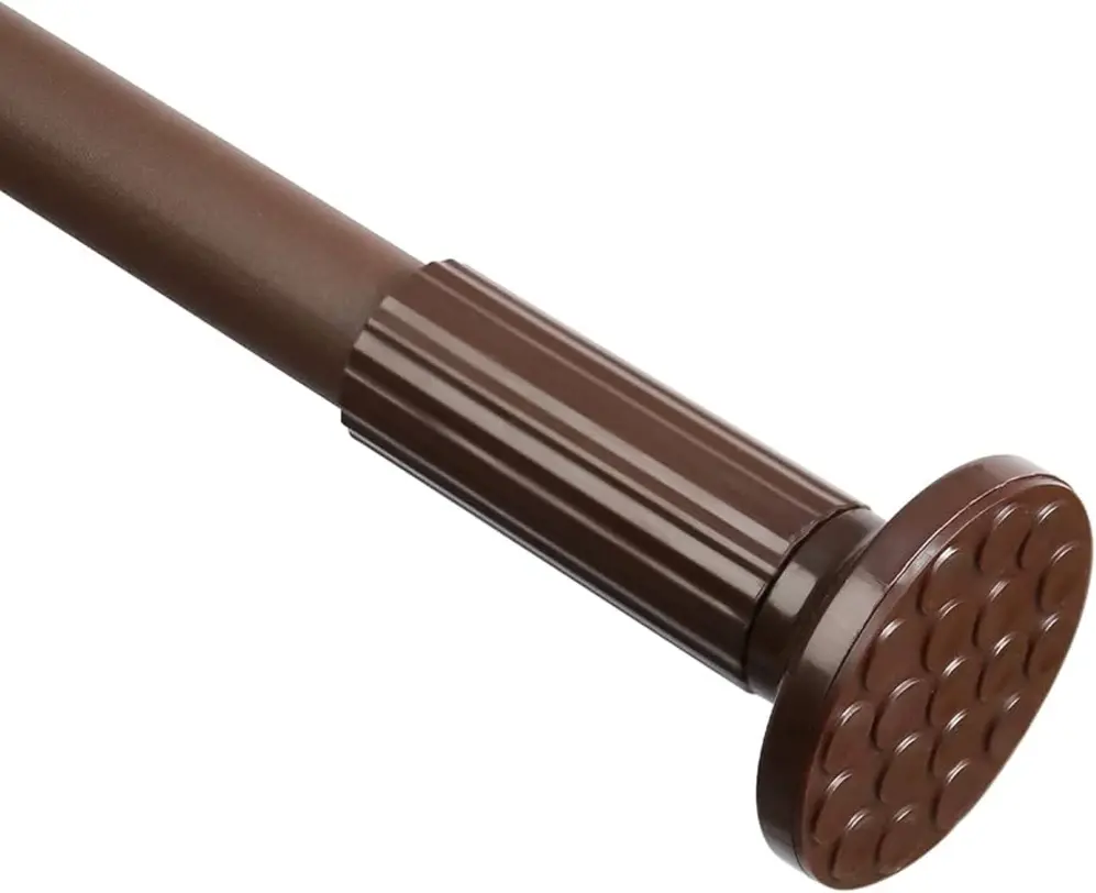 Shower curtain rod end with circular base and textured grip.